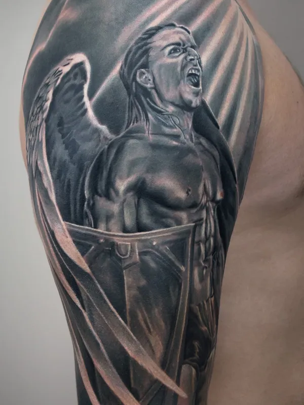 Angel tattoo with sword and shield