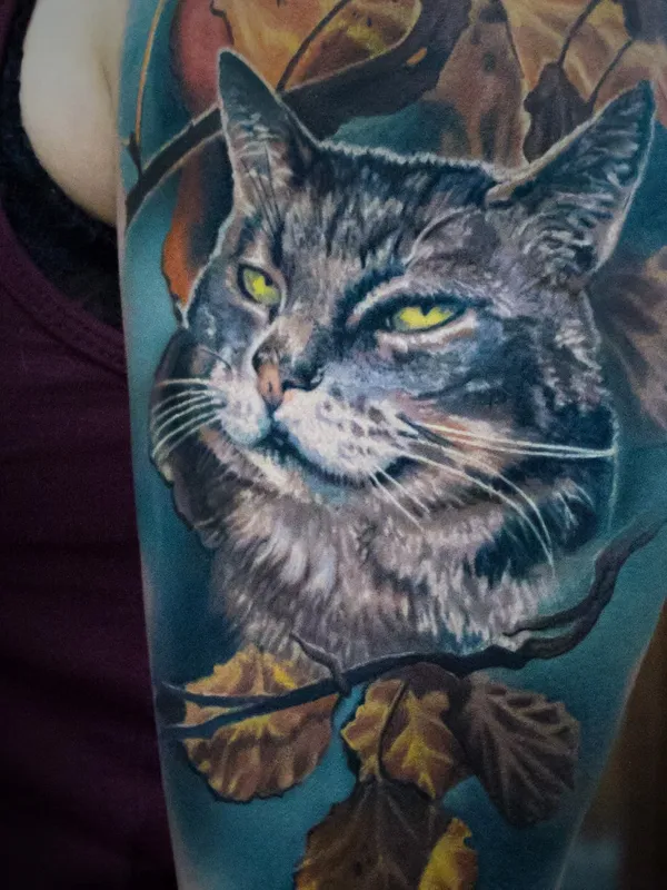 Cat in leaves tattoo